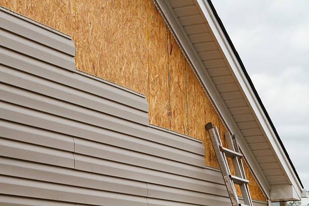 Professional Storm Damage Siding Repair technician working in Eure, NC